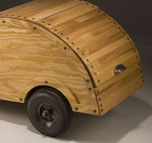 a small teardrop trailer crafted using wooden boat-building techniques, by christopher robbins